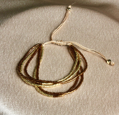 Multi-Layered Shiny Beaded Bracelet with Gold Accents