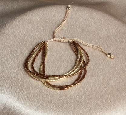 Multi-Layered Shiny Beaded Bracelet with Gold Accents