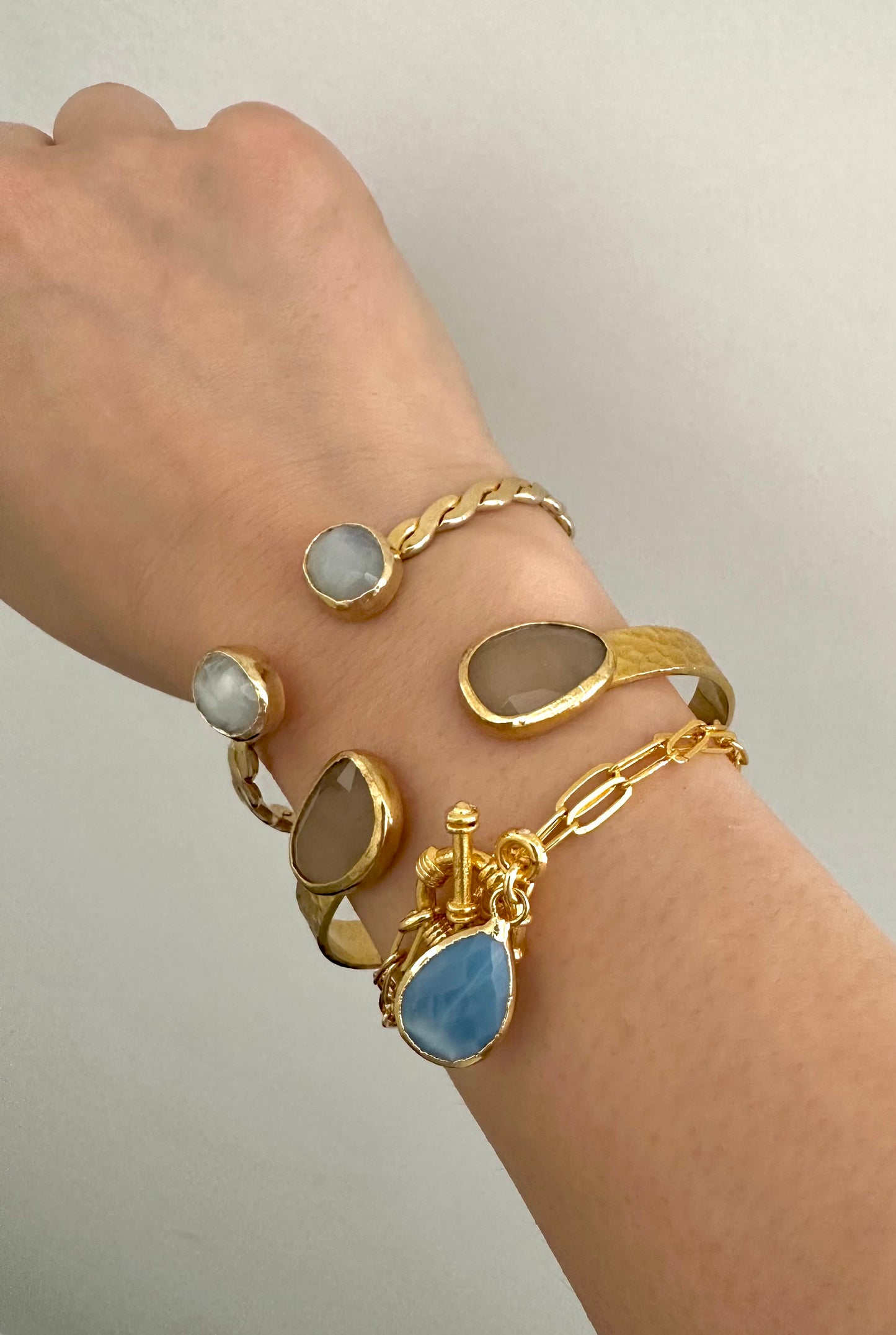 Gold-Plated Twisted Open Cuff Bracelet with Dual White Stones